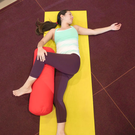 spinal twist yoga bolster